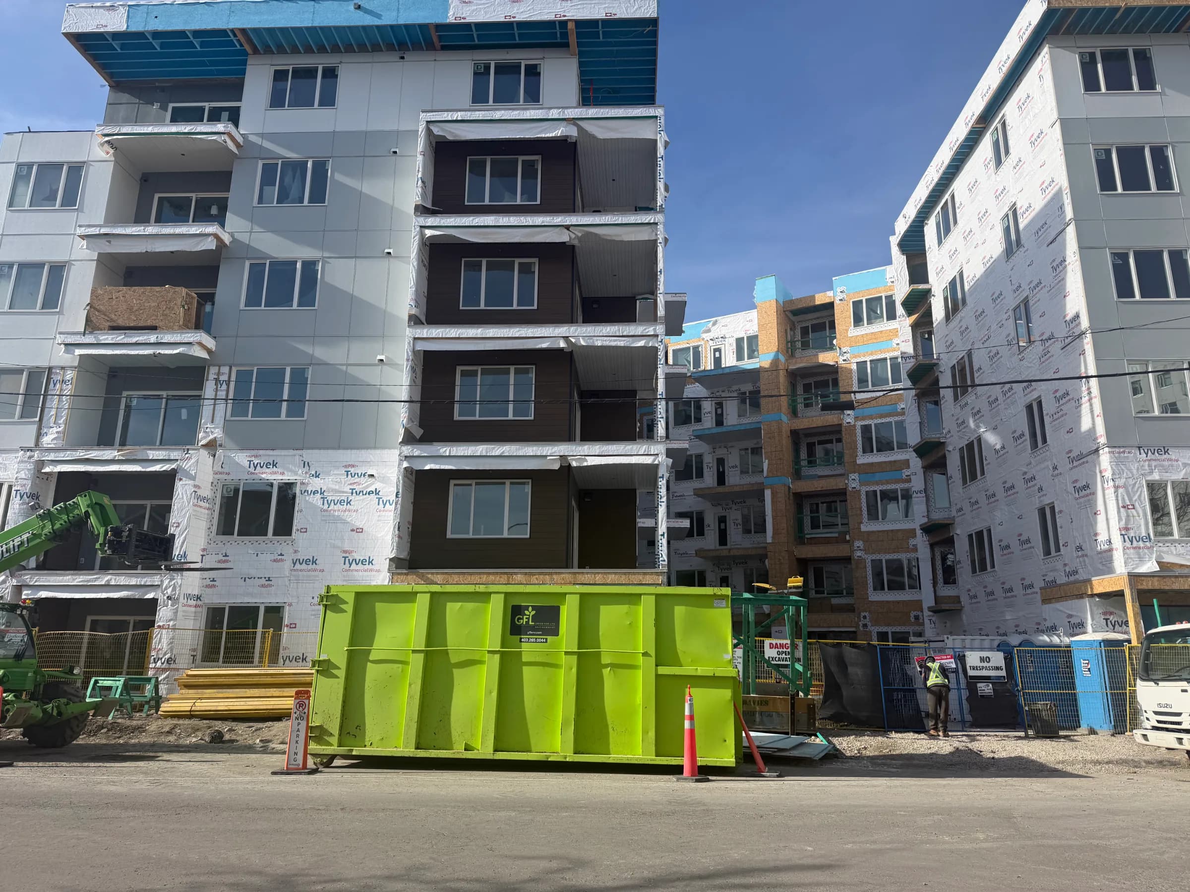 Tile installation at a 197-unit multi-family project in Kensington, Calgary