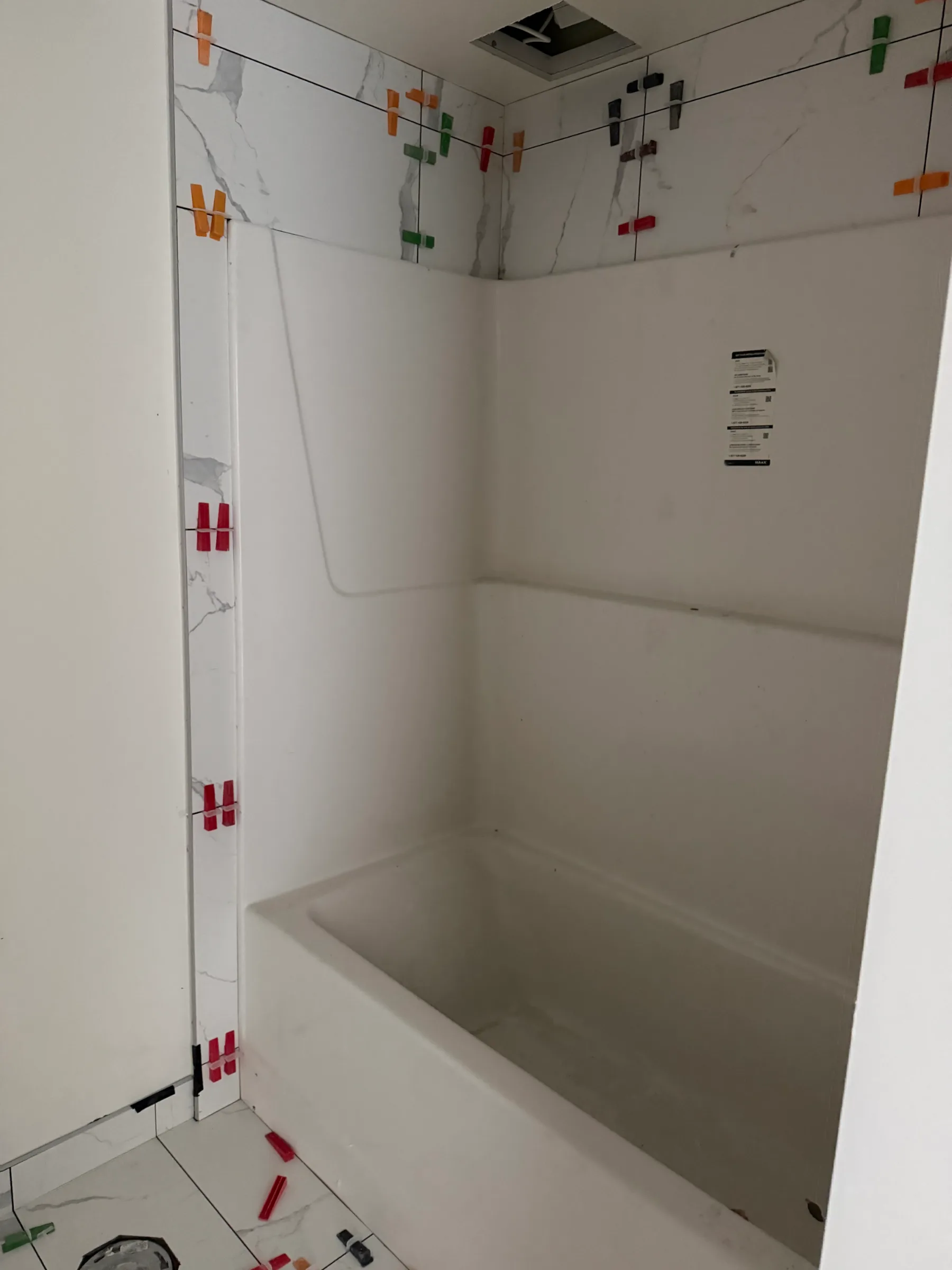 Bathroom shower tile installation with clean waterproof finishing in Calgary