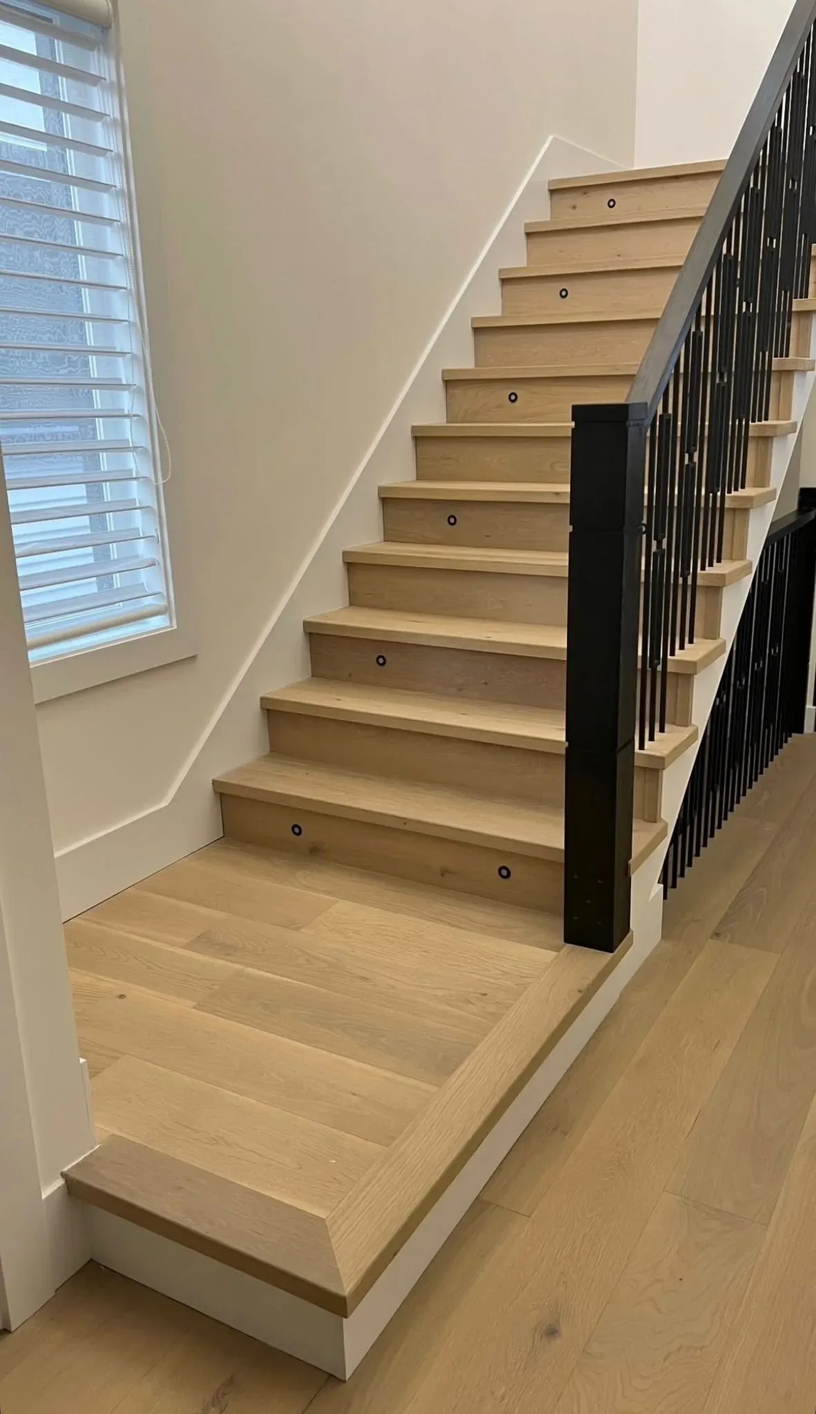 Vinyl plank flooring installation on stairs in Calgary